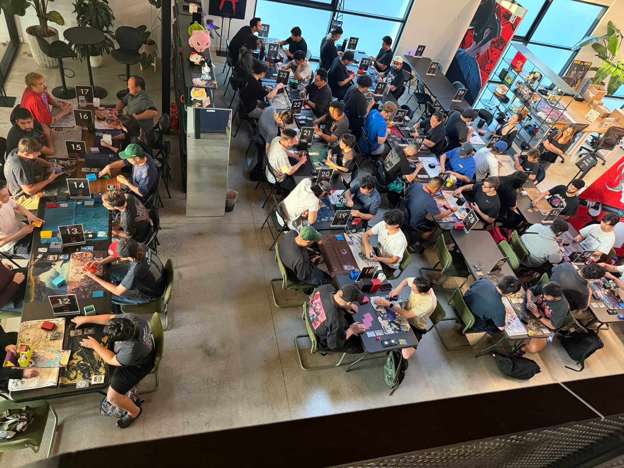 Players competing in an Azuki TCG tournament